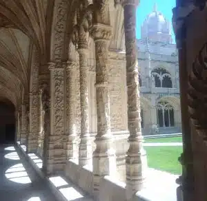 Manueline cloister at Jerónimos Monastery with elaborate stone carvings inspired by the Portuguese Discoveries.